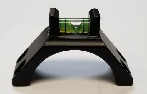 Black mounting bracket with built-in bubble level.
