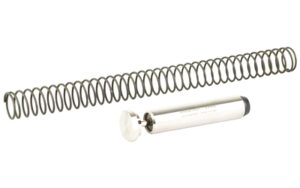 Metal spring and cylindrical tool on white background.