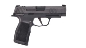 Black handgun with textured grip, side view.