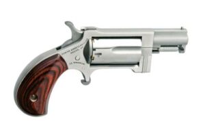 Compact revolver with wooden grip handle.