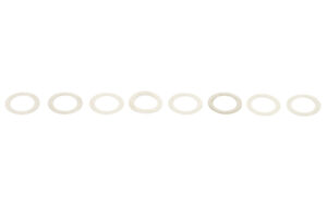 Row of identical metal washers on white background.