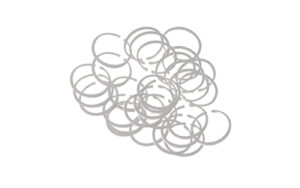 Silver wire rings scattered on a white background.