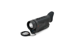 Thermal monocular with attached compass on white background.