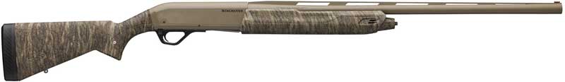 Camouflage-pattern shotgun with a long barrel.
