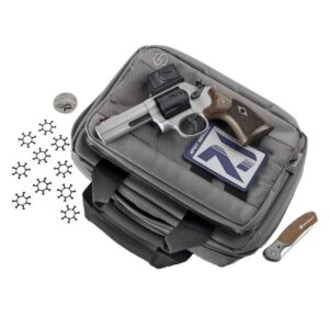 Handgun and accessories on tactical bag