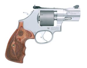 Silver revolver with wooden grip on white background