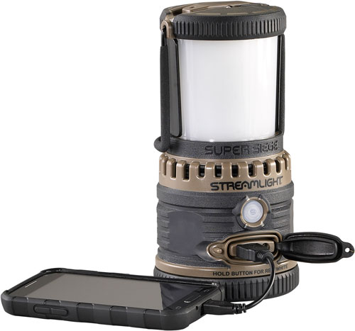 Portable camping lantern charging smartphone via USB