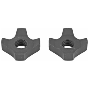 Two black four-pronged nuts on white background.