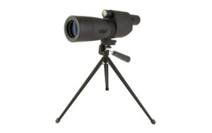 Spotting scope mounted on tripod against white background