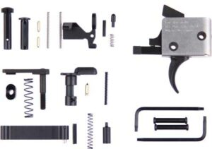 Various firearm trigger assembly parts on white background.