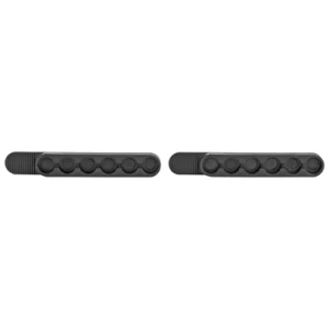 Two black molded grip pads for bicycles.