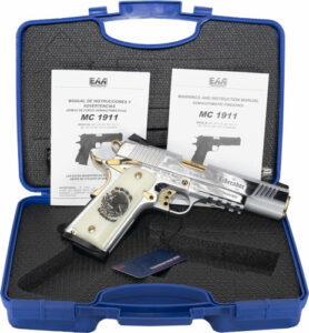 Silver pistol in case with manuals.