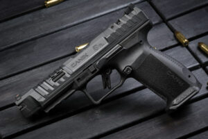 Semi-automatic handgun with scattered bullets on table