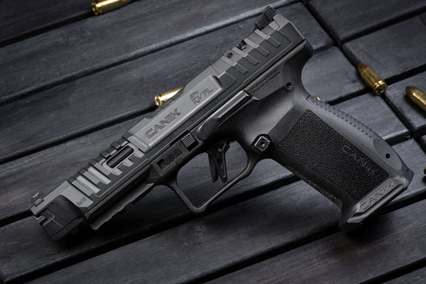 Semi-automatic handgun with scattered bullets on table