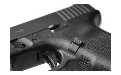 Close-up of a handgun's trigger and grip