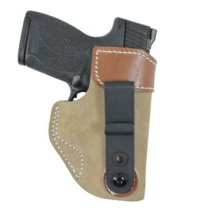 Handgun in leather belt holster