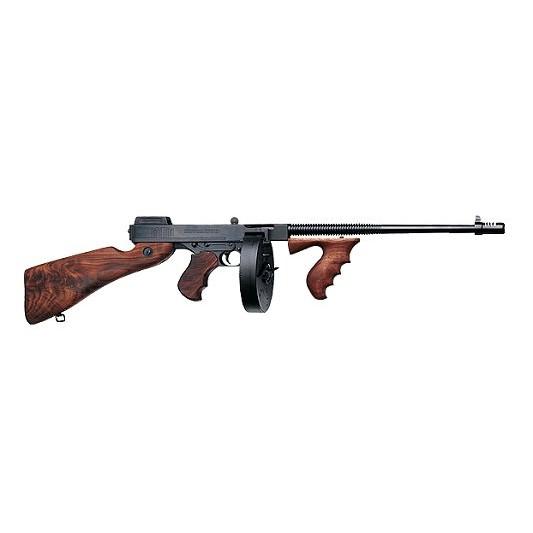 Tommy gun with wooden stock and drum magazine.