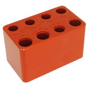 Orange metal block with multiple circular holes