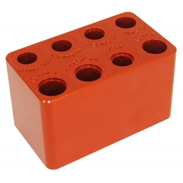 Orange metal block with multiple circular holes