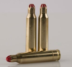 Three gold blank bullet cartridges with red sealant.