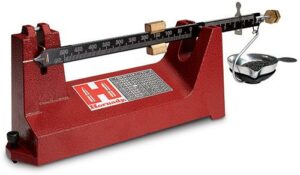 Red triple-beam balance scale with metal pan