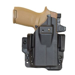 Pistol in a black holster on white background.