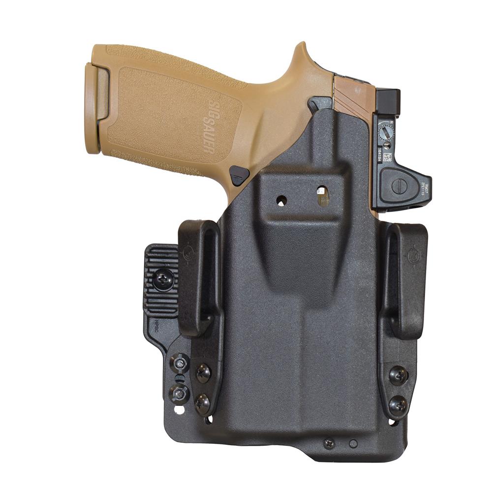 Pistol in a black holster on white background.