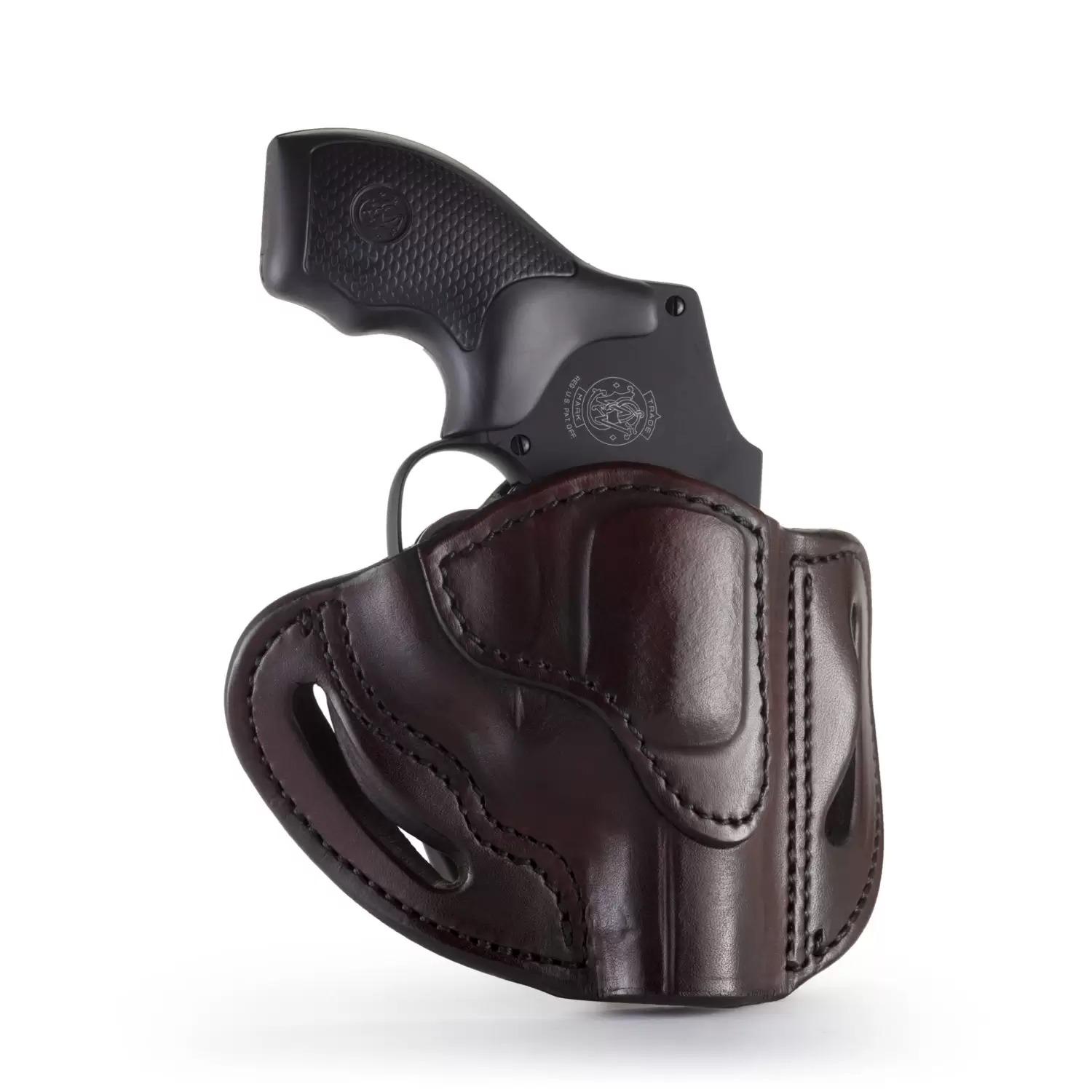Black revolver in dark leather holster