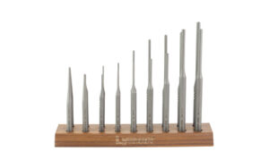 Metal pin punch set in wooden stand