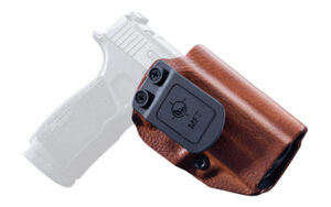 Brown leather handgun holster with black belt clip