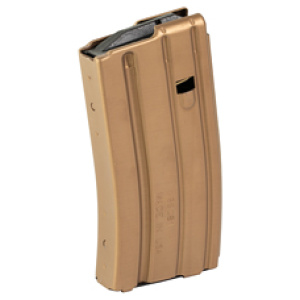 Tan rifle magazine standing upright, isolated view.