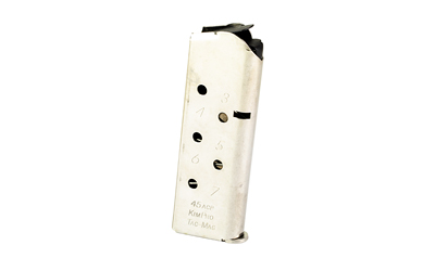 White handgun magazine with witness holes
