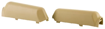 Beige plastic automotive parts on white background.