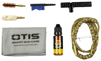 Gun cleaning kit with brushes and oil bottle.