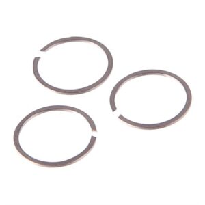 Three metal circlips on a white background.