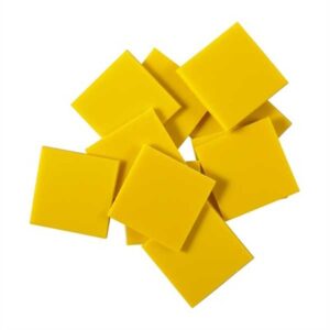 Pile of yellow adhesive plastic squares.