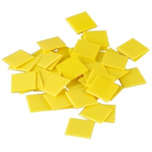 Pile of yellow square plastic tiles
