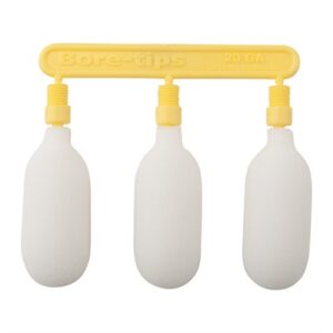 Three yellow 20 GA bore tips on a holder.