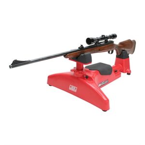 Rifle on red shooting rest with scope