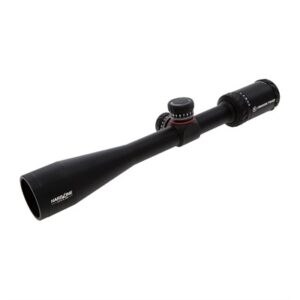 Rifle scope with adjustable magnification and focus knob.