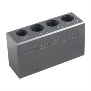Metal block with holes and engraved website address.
