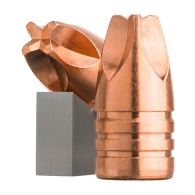 Copper bullet and block on white background.