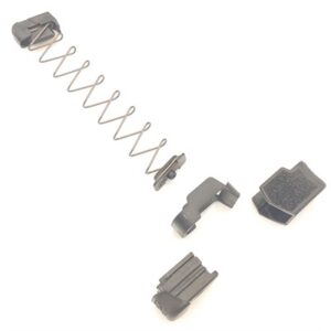 Disassembled magazine components on white background.