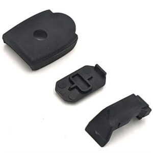 Three black rubber gun parts on white background.