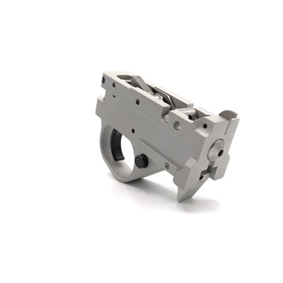 Silver rifle trigger mechanism assembly piece.
