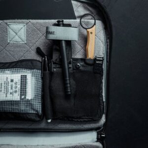 Compact tactical gear in organized bag compartments.