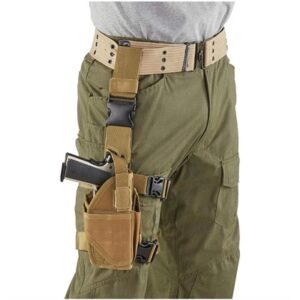 Person wearing tactical pants with handgun in holster.