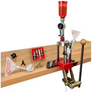 Reloading press with reloading tools on bench.