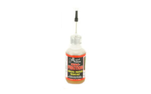 Small bottle of gun lubricating oil with needle applicator
