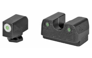 Three black pistol sights with green dots